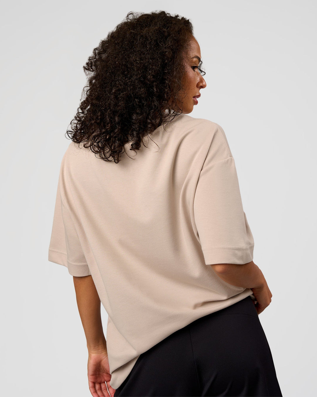 Woman wearing AfterDark ZeroCrease Oversized Tee - Shale Beige | Model:Jasmine | Size:XS - view 8