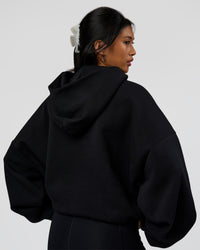 Woman wearing AfterDark ZeroCrease Oversized Hoodie - Black | Model:Loren | Size:XS