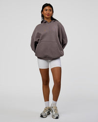 Woman wearing AfterDark ZeroCrease Oversized Hoodie - Duskstone | Model:Loren | Size:XS