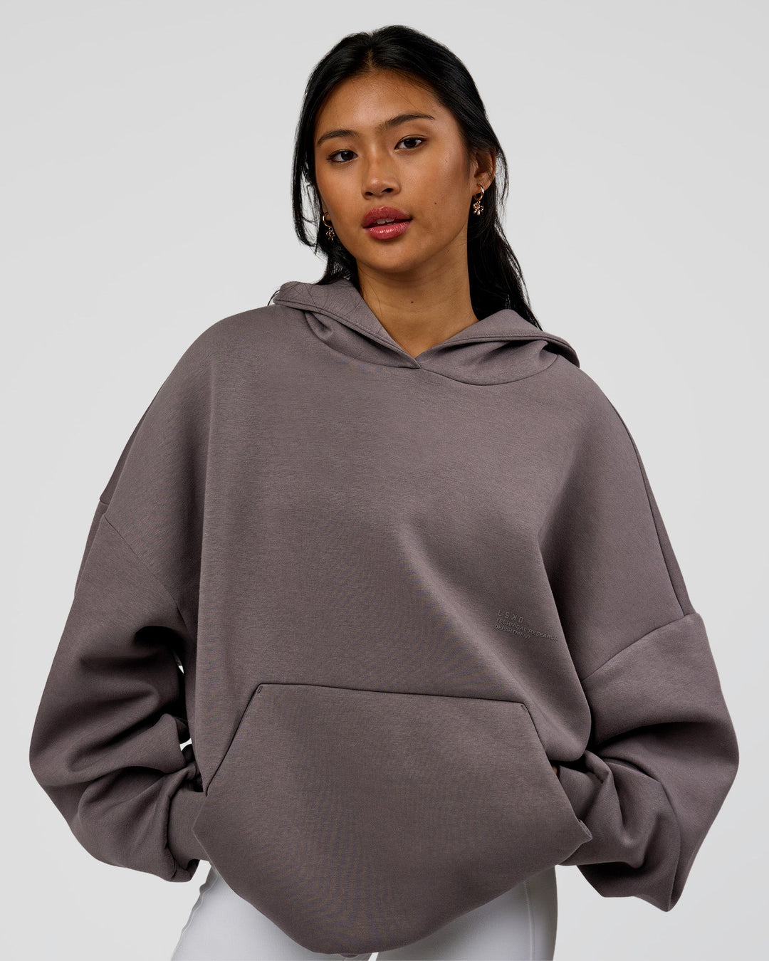 Woman wearing AfterDark ZeroCrease Oversized Hoodie - Duskstone | Model:Loren | Size:XS