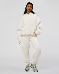 Woman wearing AfterDark ZeroCrease Oversized Hoodie - Silver Marl | Model:Loren |Size:XS