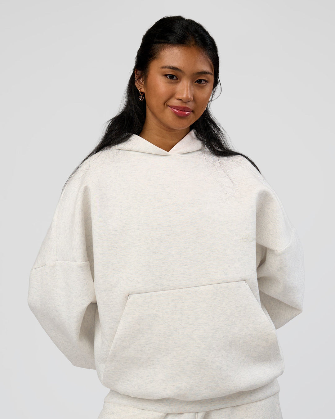 Woman wearing AfterDark ZeroCrease Oversized Hoodie - Silver Marl | Model:Loren |Size:XS