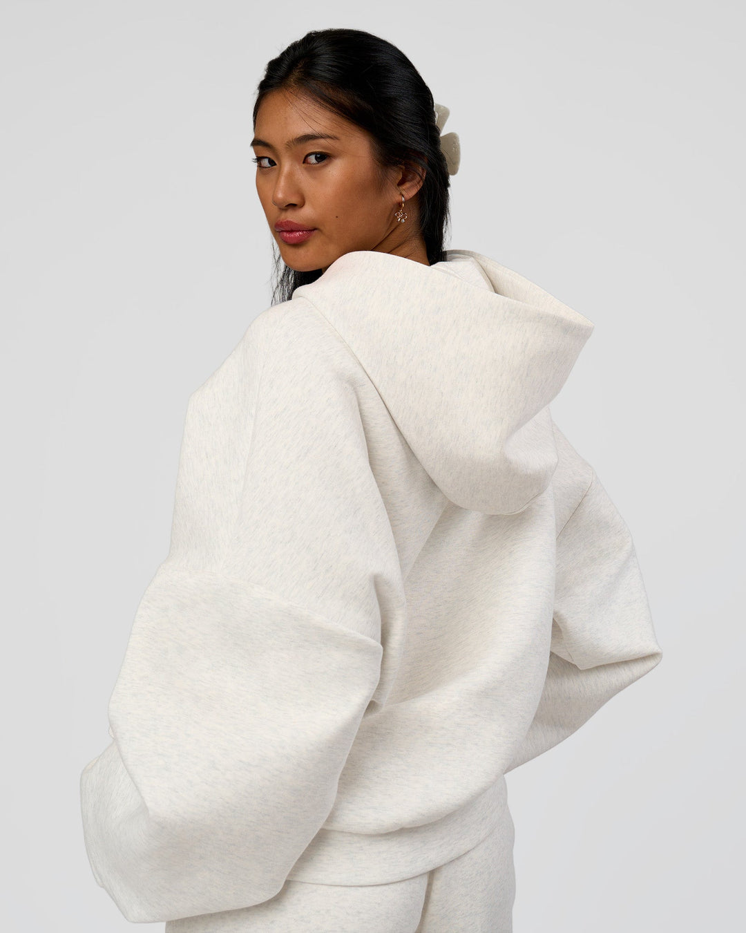 Woman wearing AfterDark ZeroCrease Oversized Hoodie - Silver Marl | Model:Loren |Size:XS
