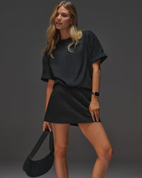 Woman wearing AfterDark ZeroCrease Oversized Tee - Black | Model:Leilani | Size:XS