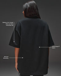 Woman wearing AfterDark ZeroCrease Oversized Tee - Black | Model:Ruby | Size:XS