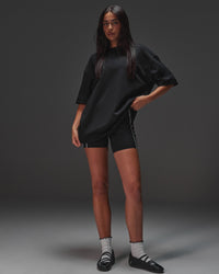 Woman wearing AfterDark ZeroCrease Oversized Tee - Black | Model:Ruby | Size:XS