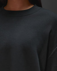 Woman wearing AfterDark ZeroCrease Oversized Tee - Black | Model:Ruby | Size:XS
