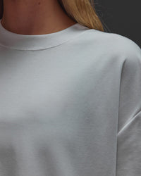 Woman wearing AfterDark ZeroCrease Oversized Tee - White | Model:Leilani | Size:XS