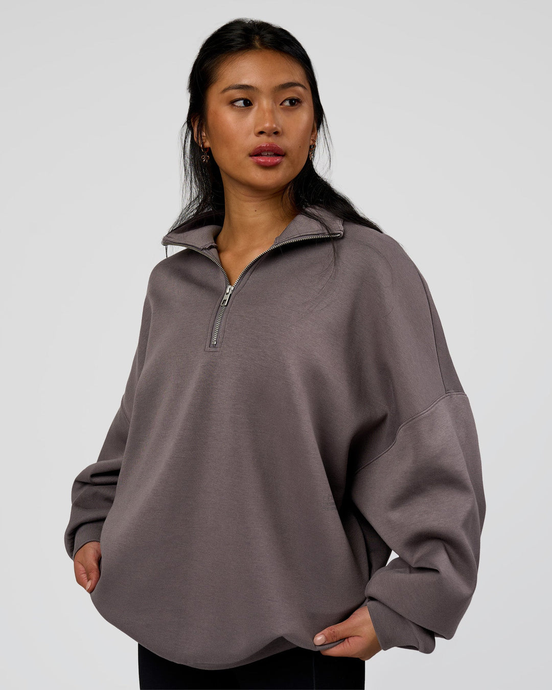 Woman wearing AfterDark ZeroCrease Quarter Zip - Duskstone | Model:Loren | Size:XS