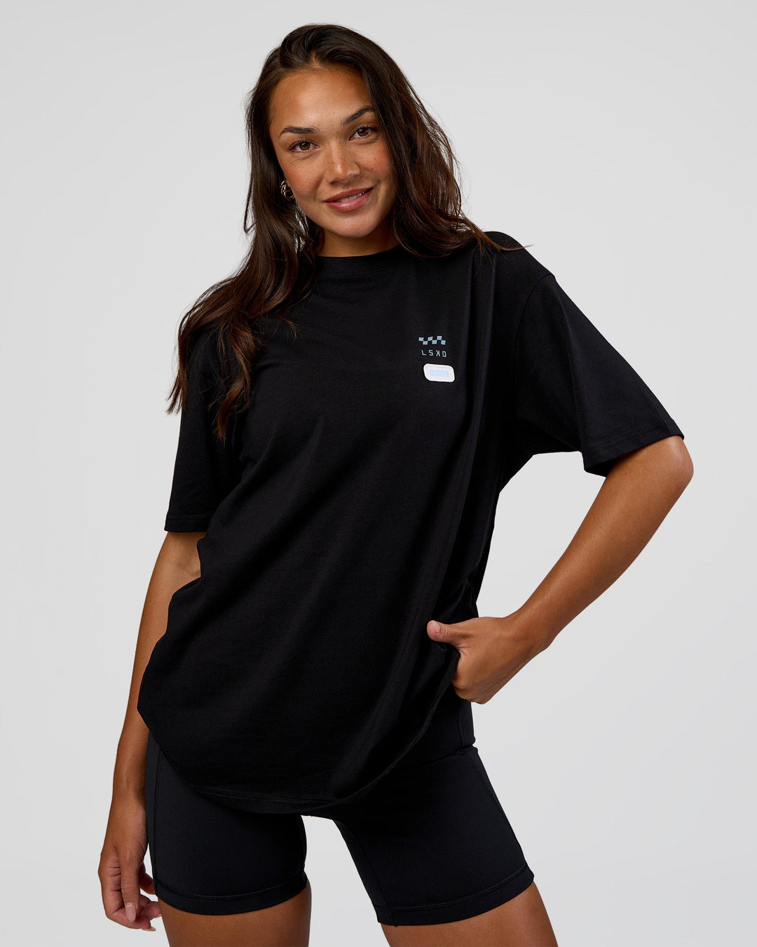 Woman wearing Archive FLXCotton Oversized Tee - Black-Open Air | Model:Kirstyn | Size:XS