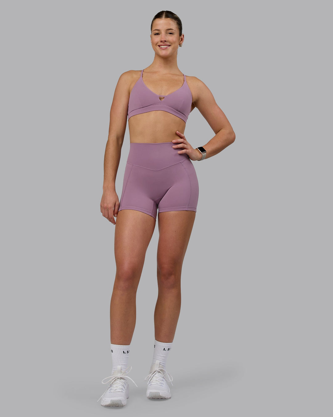 Woman wearing Ascend Sports Bra - Grape