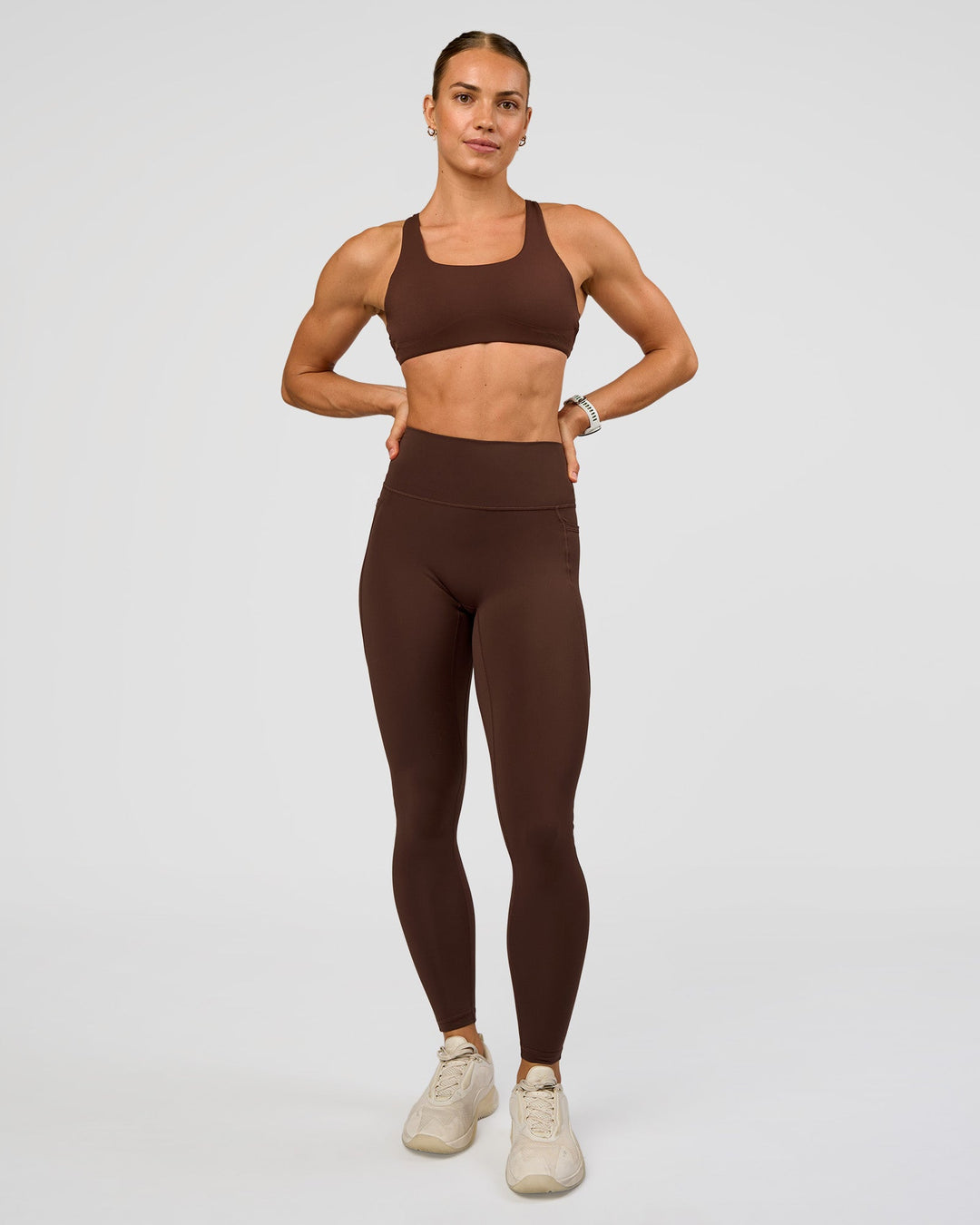 Woman wearing Aspire Sports Bra - Hot Chocolate | Model:Maja | Size:XS - view 3