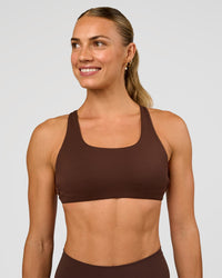 Woman wearing Aspire Sports Bra - Hot Chocolate | Model:Maja | Size:XS | Thumbnail Index: 1