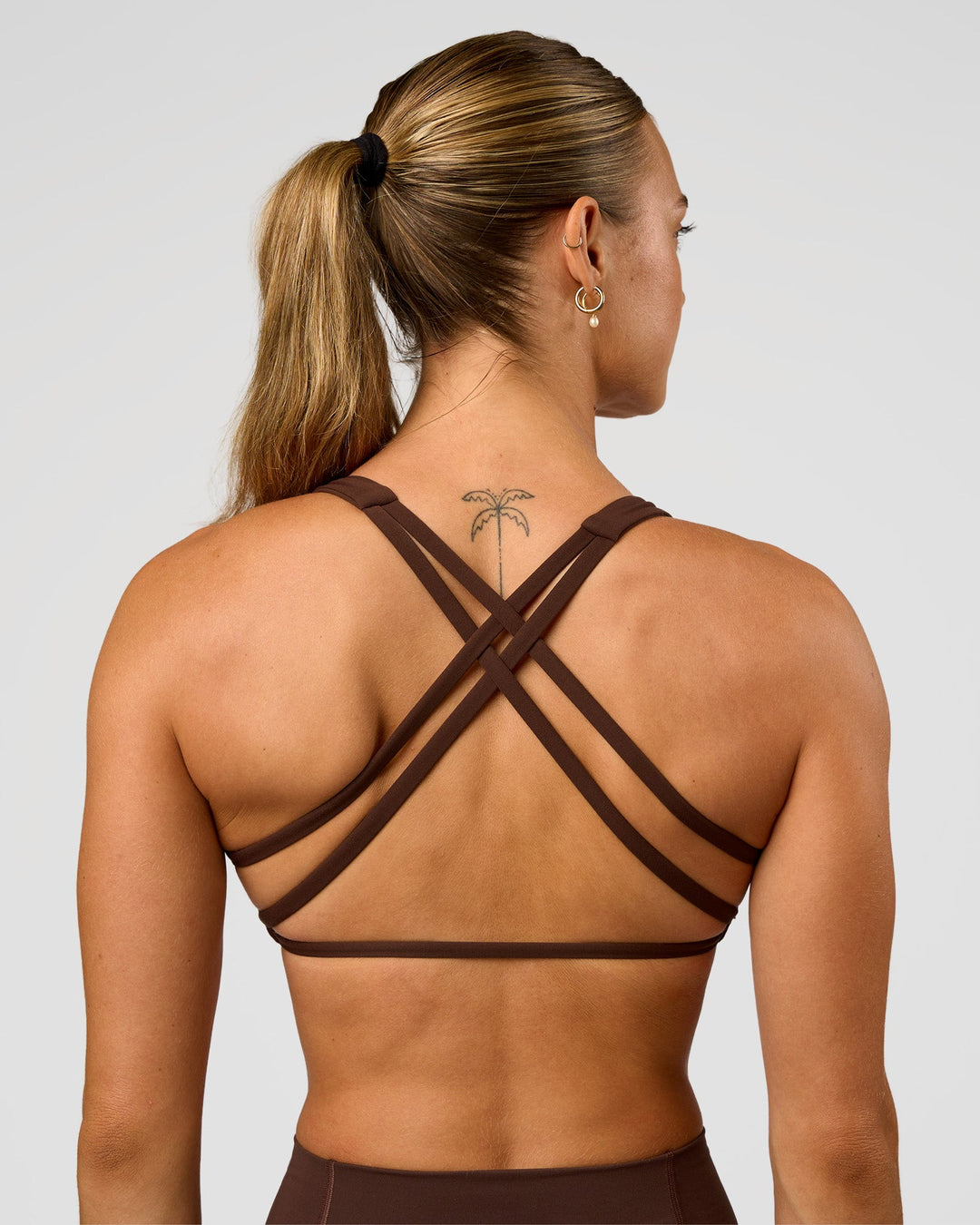 Woman wearing Aspire Sports Bra - Hot Chocolate | Model:Maja | Size:XS - view 6