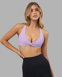 Woman wearing Aspire Twist Sports Bra - Pale Lilac | Model:Leilani | Size:XS | Thumbnail Index: 6