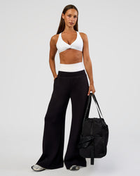 Woman wearing Aspire Twist Sports Bra - White | Model:Brylee | Size:XS | Thumbnail Index: 2