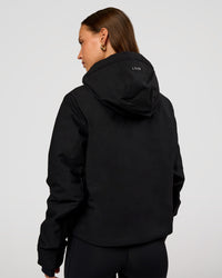 Woman wearing Auxiliary 2.0 Jacket - Black | Model:Brylee | Size:XS