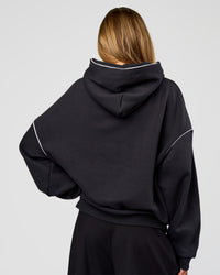 Woman wearing Axis Oversized Hoodie - Caviar-White | Model:Georgia | Size:XS