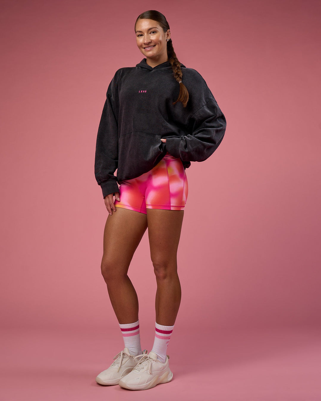 Woman wearing BCAM Washed Unisex Oversized Hoodie - Black Washed-Pink | Model:Hannah | Size:XS