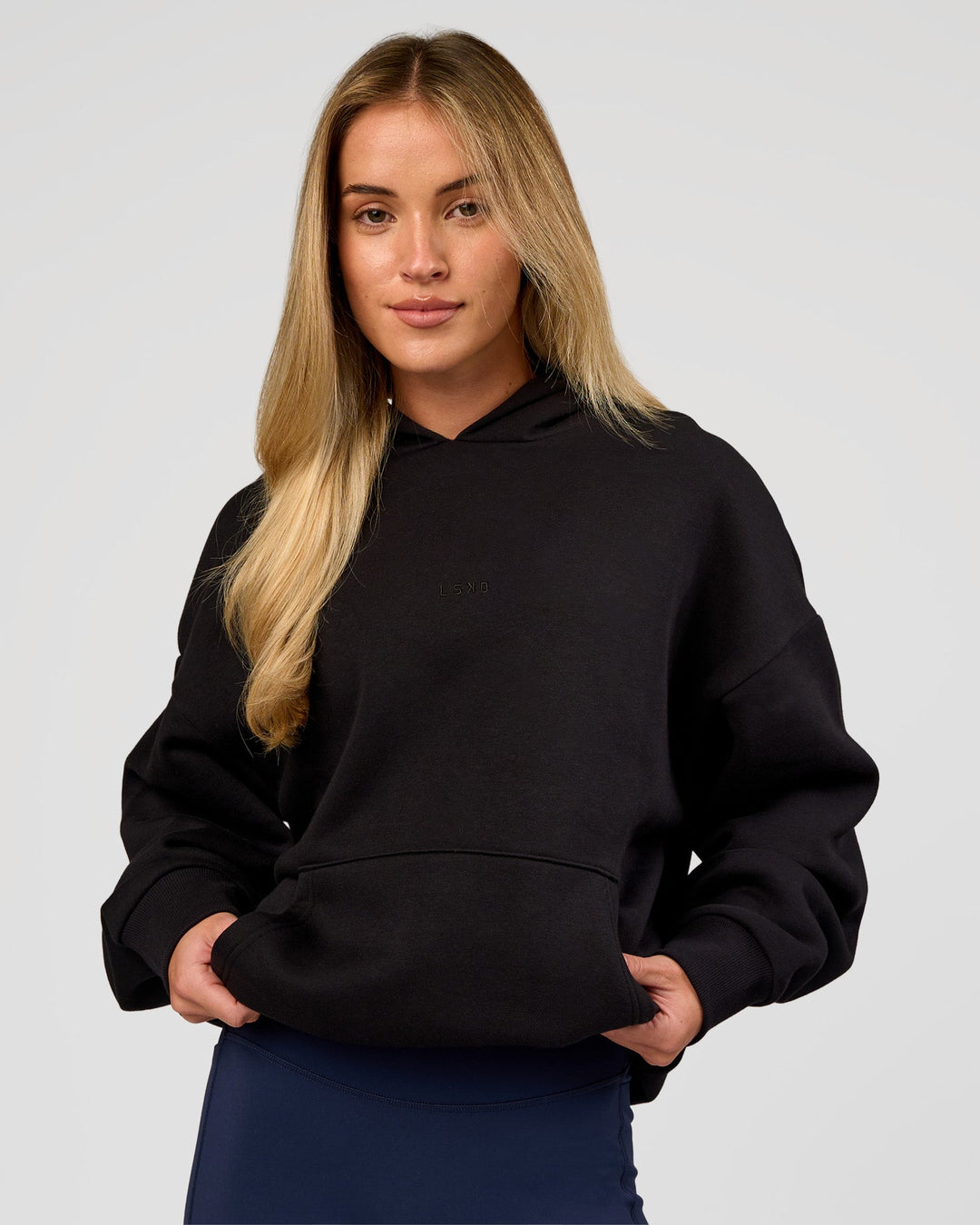 Woman wearing Base Oversized Hoodie - Black | Model:Issy | Size:XS | - view 7