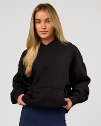 Woman wearing Base Oversized Hoodie - Black | Model:Issy | Size:XS | | Thumbnail Index: 6