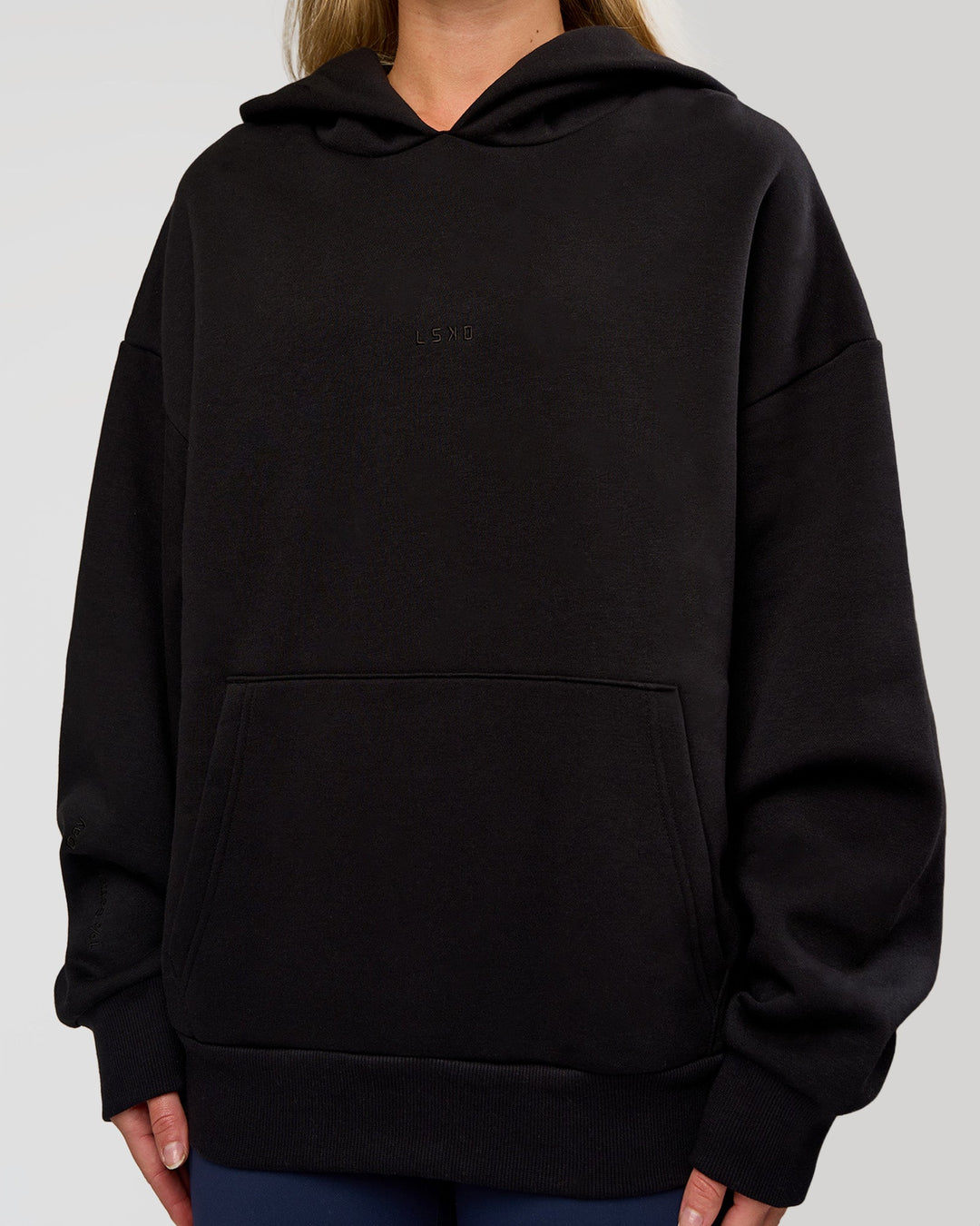 Woman wearing Base Oversized Hoodie - Black | Model:Issy | Size:XS | - view 11