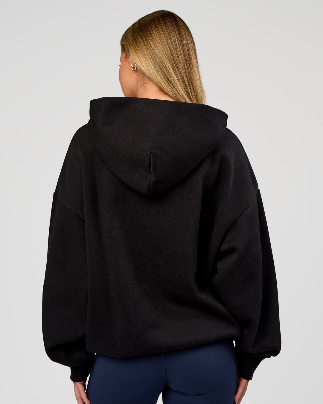 Woman wearing Base Oversized Hoodie - Black | Model:Issy | Size:XS | - view 8