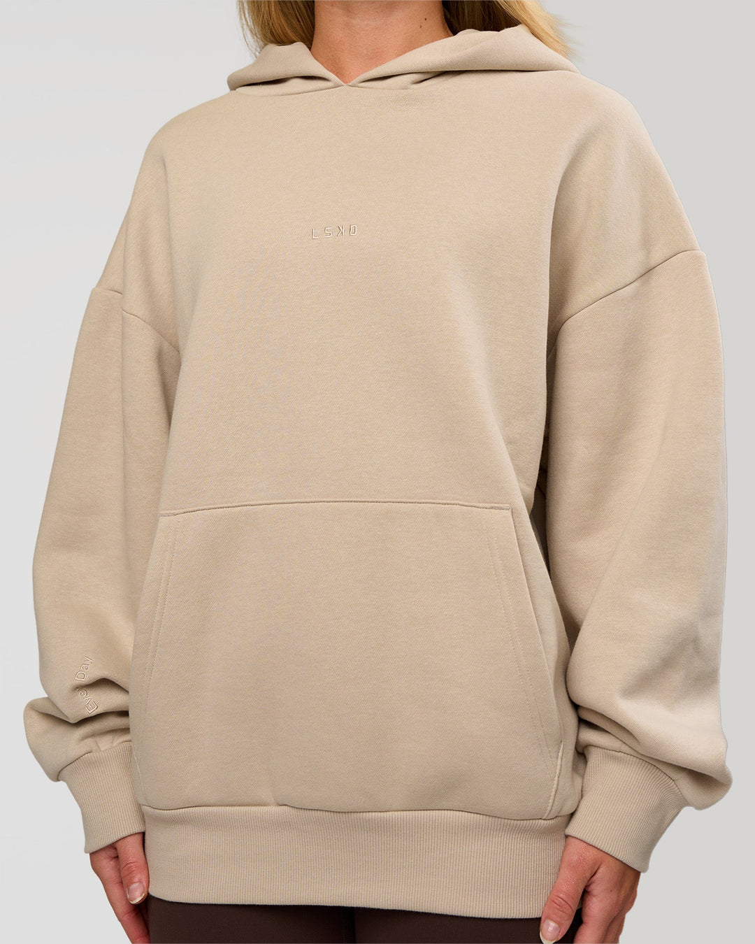 Woman wearing Base Oversized Hoodie - Shale Beige | Model:Issy | Size: XS | - view 8