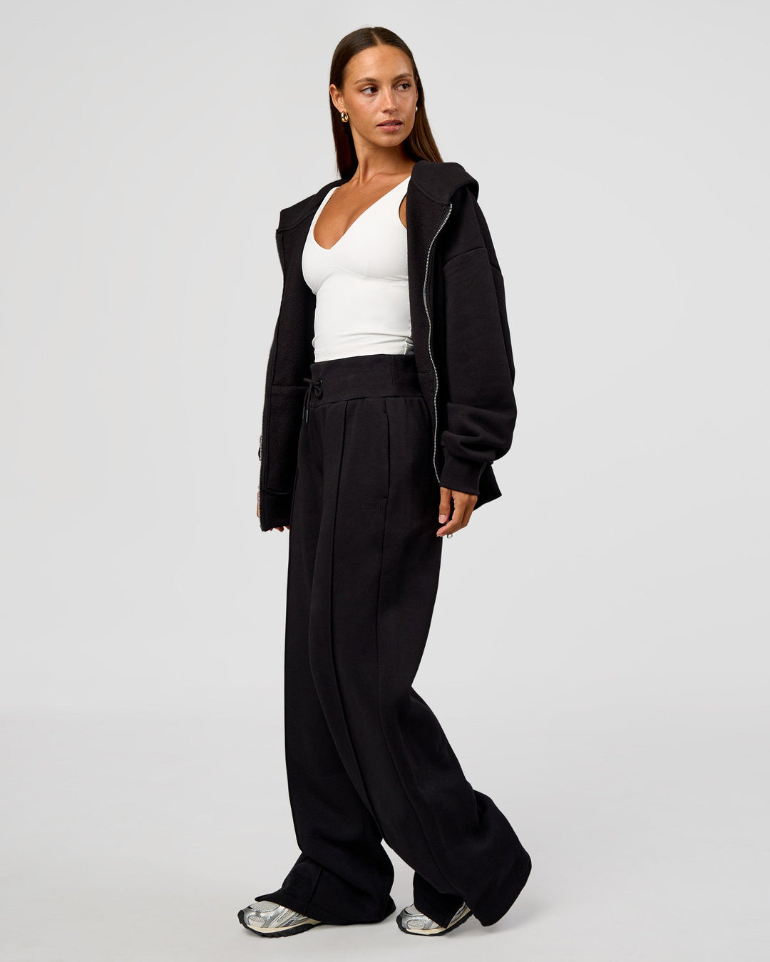 Woman wearing Base Zip Through Oversized Hoodie - Black | Model:Brylee | Size:XS