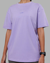 Woman wearing Be Yourself FLXCotton Tee Oversize - Violet Ray-Royal Purple | Model:Rhiley | Size:XS