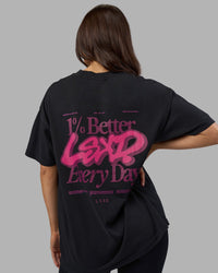 Woman wearing Break Through Heavyweight Oversized Tee - Black Washed-Plum Caspia | Model:Phoebe | Size:XS