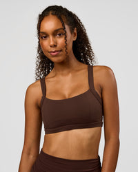 Woman wearing CF Move Through It Sports Bra - Hot Chocolate | Model:Jordan | Size:XS