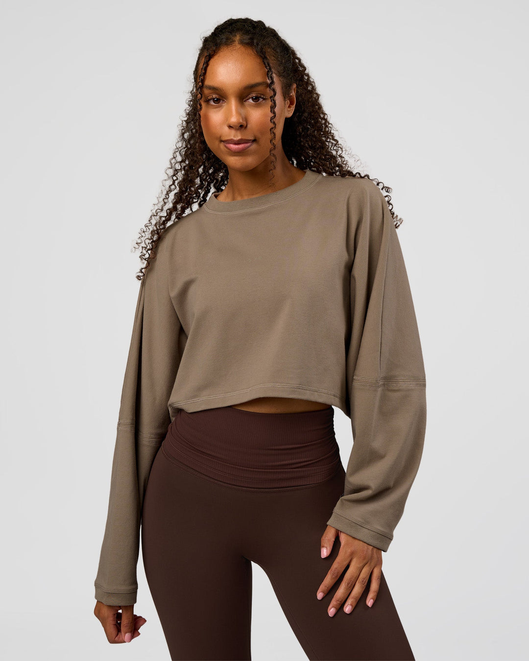 Woman wearing CF Street Surge Long Sleeve Tee - Taupe Ash | Model:Jordan | Size:XS
