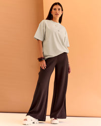 Woman wearing CF Unisex Oversized Heavyweight FLXCotton Tee - Clay-CF X LSKD Sport | Model:Chloe | Size:XS