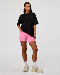 Woman wearing CFT BNE 26 FLXCotton Oversized Tee in Black | Model:Brylee | Size:XS | Thumbnail Index: 8