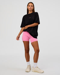 Woman wearing CFT BNE 26 FLXCotton Oversized Tee in Black | Model:Brylee | Size:XS | Thumbnail Index: 9