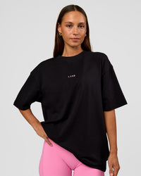 Woman wearing CFT BNE 26 FLXCotton Oversized Tee in Black | Model:Brylee | Size:XS | Thumbnail Index: 6