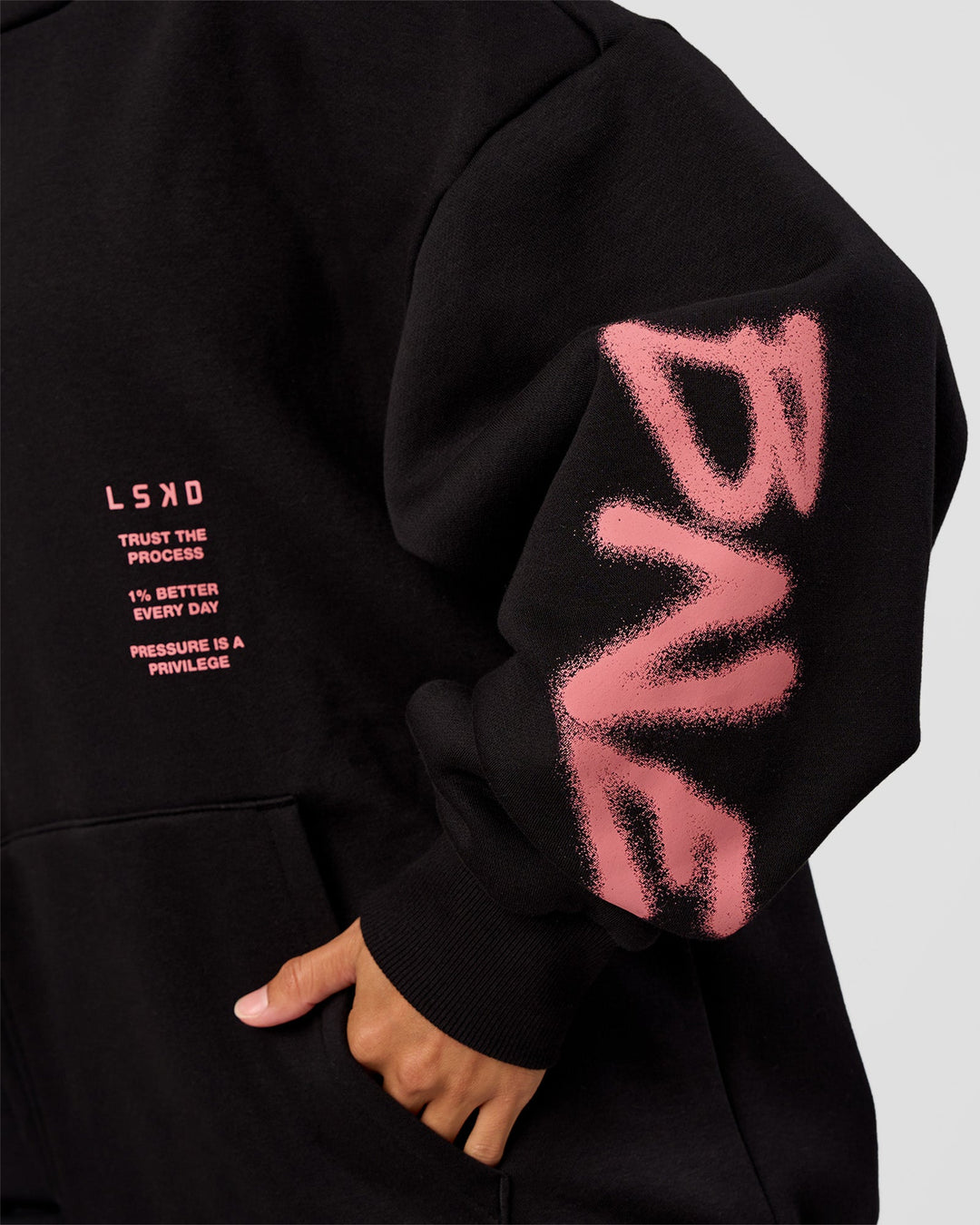 Woman wearing CFT BNE 26 Unisex Oversized Hoodie - Black-Candy Pink | Model:Brylee | Size:XS