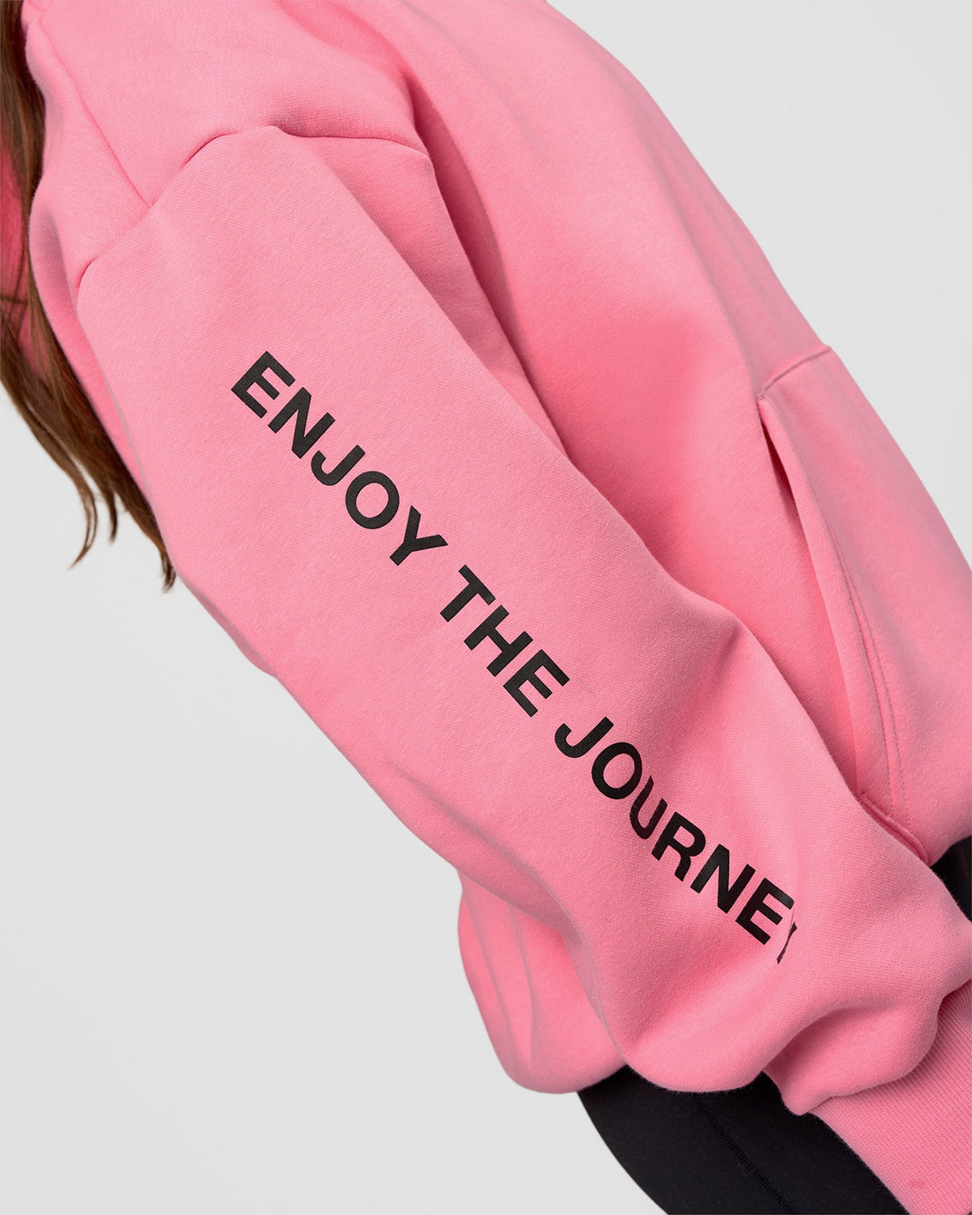 Woman wearing CFT BNE 26 Unisex Oversized Hoodie - Candy Pink-Black | Model:Brylee | Size:XS