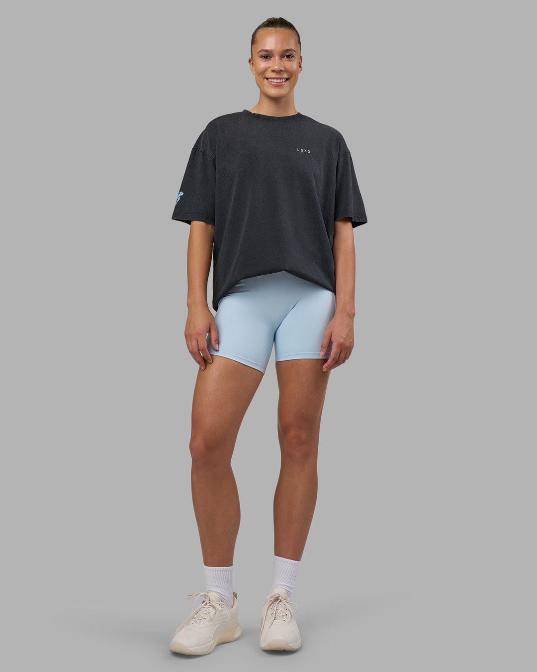 Woman wearing Cali FLXCotton Oversized Tee - Black Washed | Model:Charlize | Size:XS