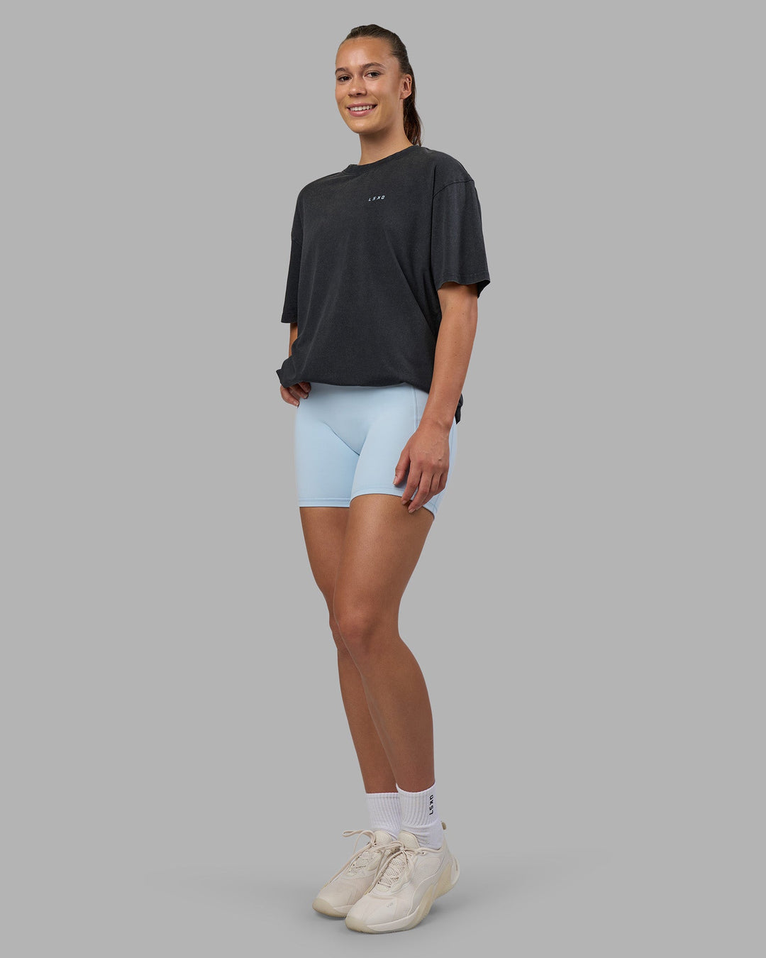 Woman wearing Cali FLXCotton Oversized Tee - Black Washed | Model:Charlize | Size:XS