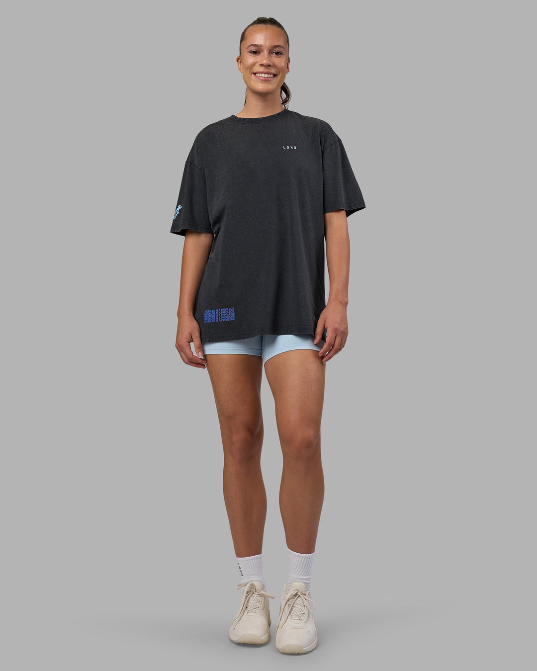 Woman wearing Cali FLXCotton Oversized Tee - Black Washed | Model:Charlize | Size:XS