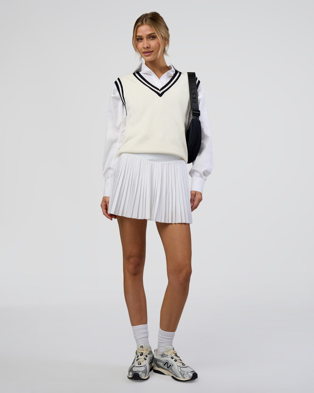 Woman wearing Clubhouse Vest - Off White-Future Navy | Model:Leilani | Size:XS - view 7