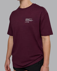 Woman wearing Coffee Run FLXCotton Oversized Tee - Cherry Lacquer-Black | Model:Sav | Size:XS