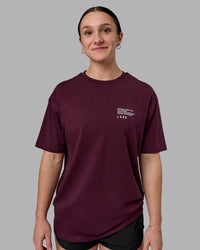 Woman wearing Coffee Run FLXCotton Oversized Tee - Cherry Lacquer-Black | Model:Sav | Size:XS