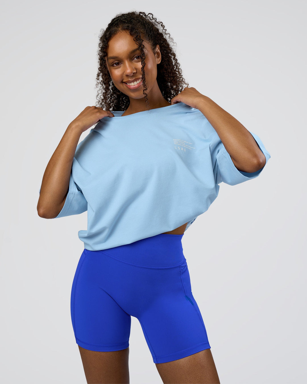 Woman wearing Coffee Run FLXCotton Oversized Tee - Open Air-White | Model:Jordan | Size:XS