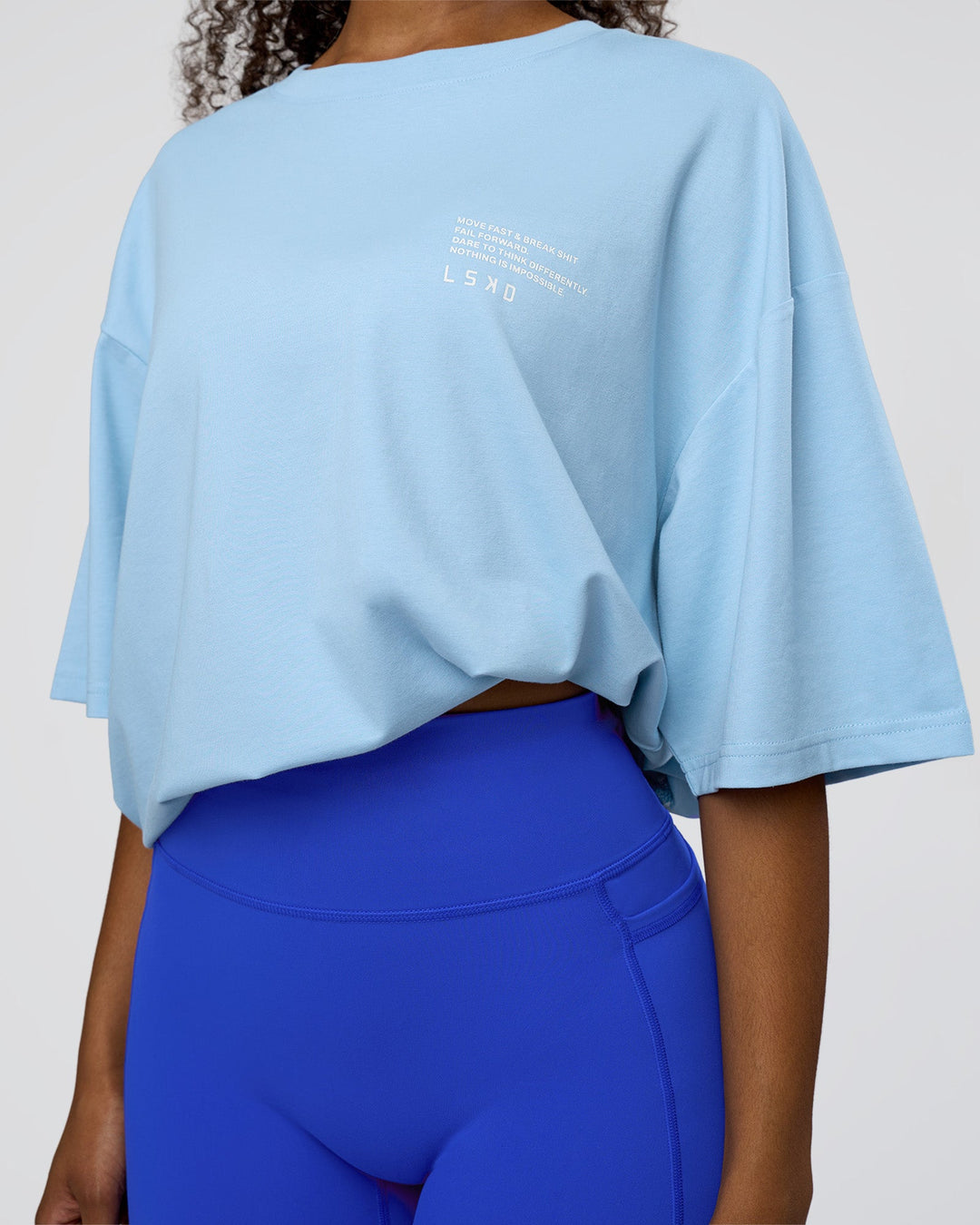 Woman wearing Coffee Run FLXCotton Oversized Tee - Open Air-White | Model:Jordan | Size:XS