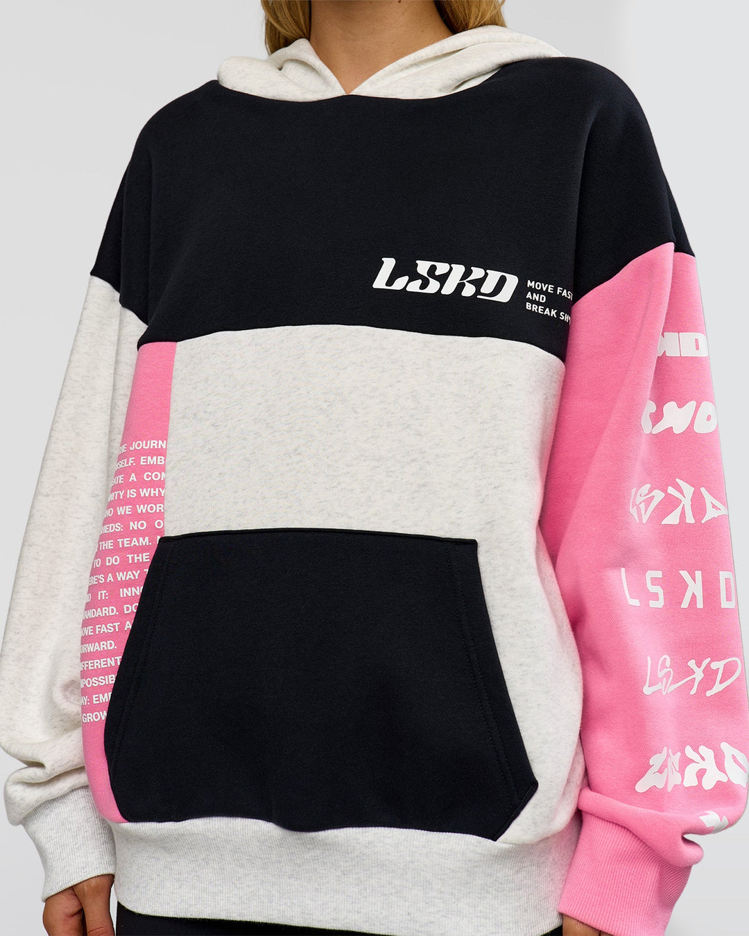 Woman wearing Deconstructed Fleece Hoodie - Caviar-Candy Pink-Grey Marl | Model:Leilani | Size:XS