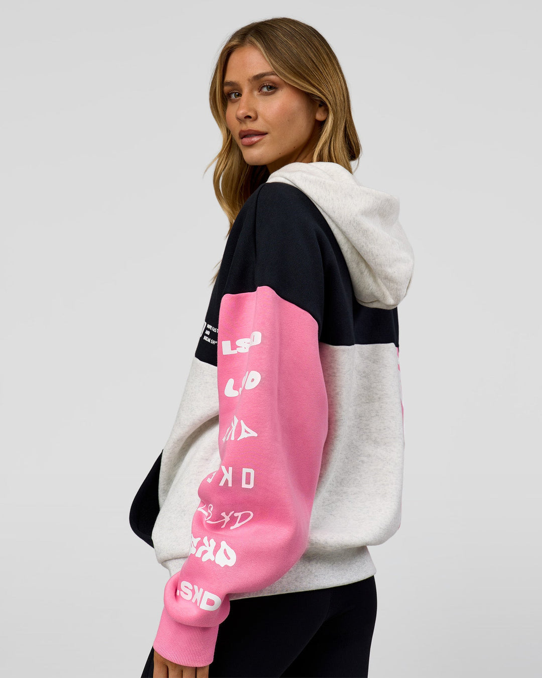 Woman wearing Deconstructed Fleece Hoodie - Caviar-Candy Pink-Grey Marl | Model:Leilani | Size:XS
