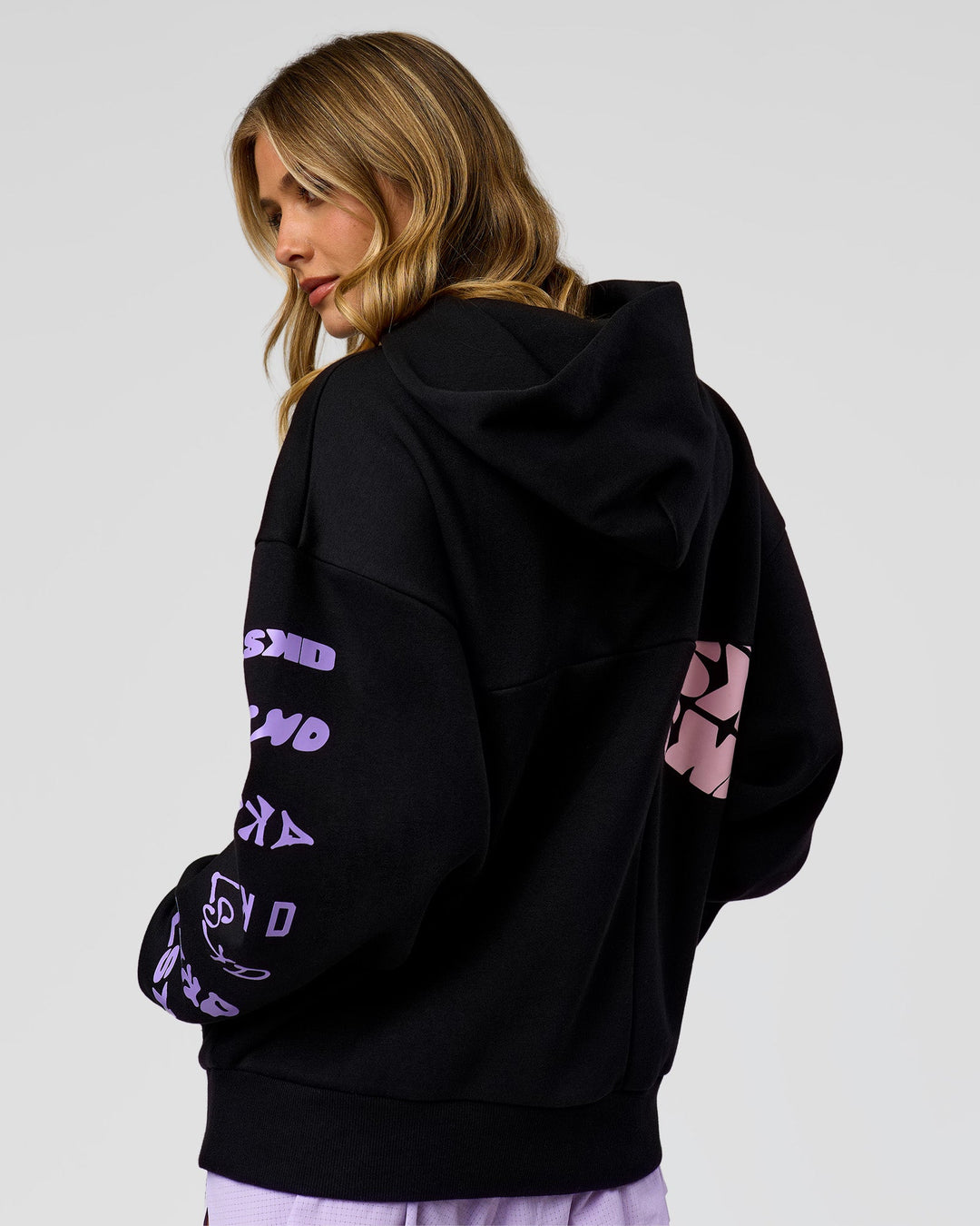 Woman wearing Deconstructed Fleece Hoodie - Caviar-Marshmallow-Pale Lilac | Model:Leilani | Size:XS
